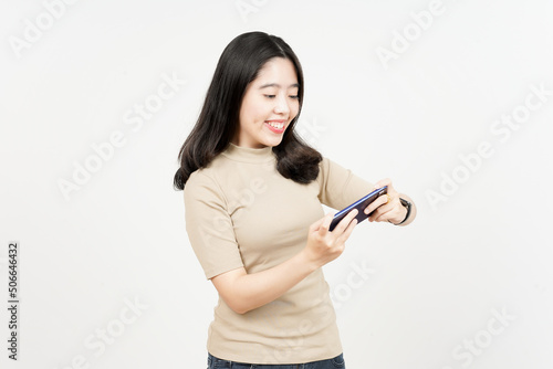 Playing Mobile Game on Smartphone Of Beautiful Asian Woman Isolated On White Background