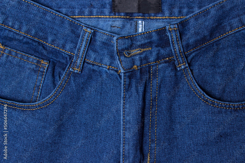 Jeans close-up. Modern comfortable clothes. Denim blue jeans texture Jeans close-up. Modern comfortable clothes. Denim blue jeans texture