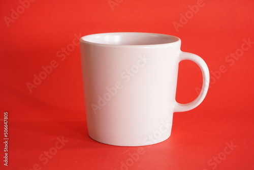white cup on red background