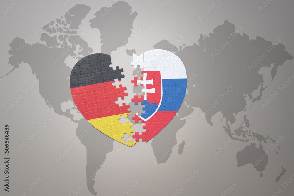 puzzle heart with the national flag of slovakia and germany on a world map background. Concept.