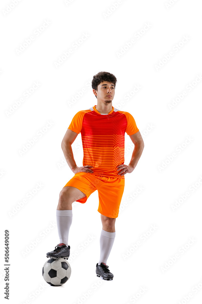Portrait of young man, asian football, soccer player posing with ball isolated on white studio background. Concept of sport, match, active lifestyle, goal and hobby Portrait of young man, asian football, soccer player posing with ball isolated on white studio background. Concept of sport, match, active lifestyle, goal and hobby