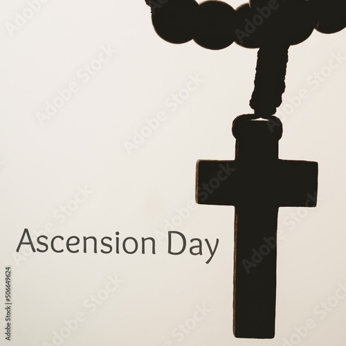 Ascension day text with cross against beige background, copy space