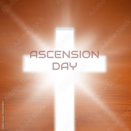 Ascension day text with cross over bright brown background, copy space