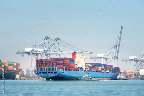 Transport Container Cargo Freight Ship loading and unloading goods containers by harbor crane in shipping port, Logistic Import Export background