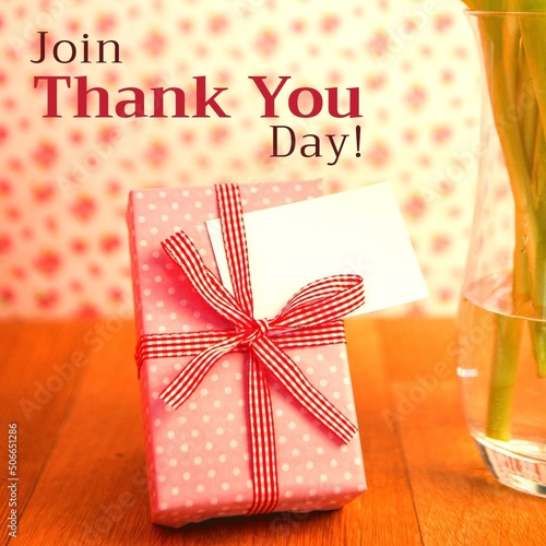 Digital composite image of gift box with blank label on table and join thank you day text