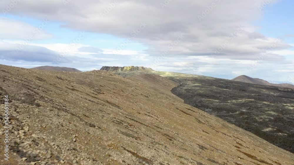 Geldingadalir volcano in Iceland showing a cinematic drone shot over massive lava field near main crater. Geldingadalir volcano in Iceland showing a cinematic drone shot over massive lava field near main crater.