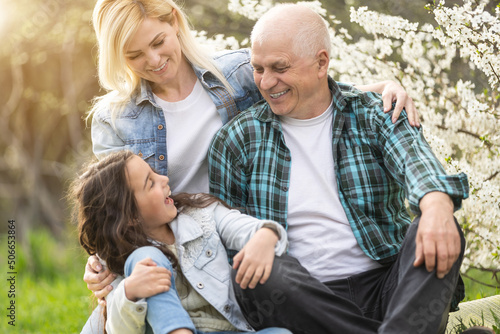 Generation Family On Grass Together in the garden