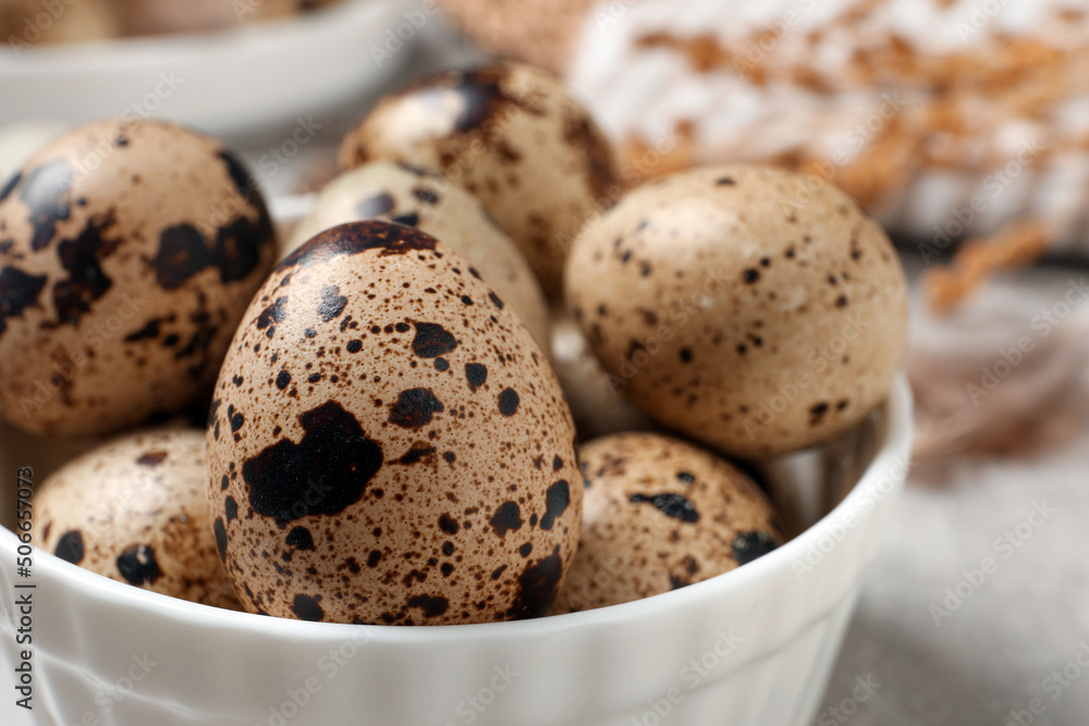 Fresh quail eggs in bowl on table, closeup Fresh quail eggs in bowl on table, closeup