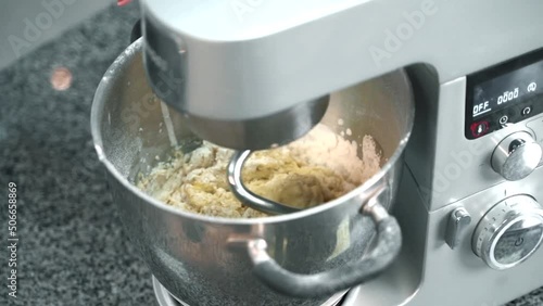 the cook beats the cream with a mixer