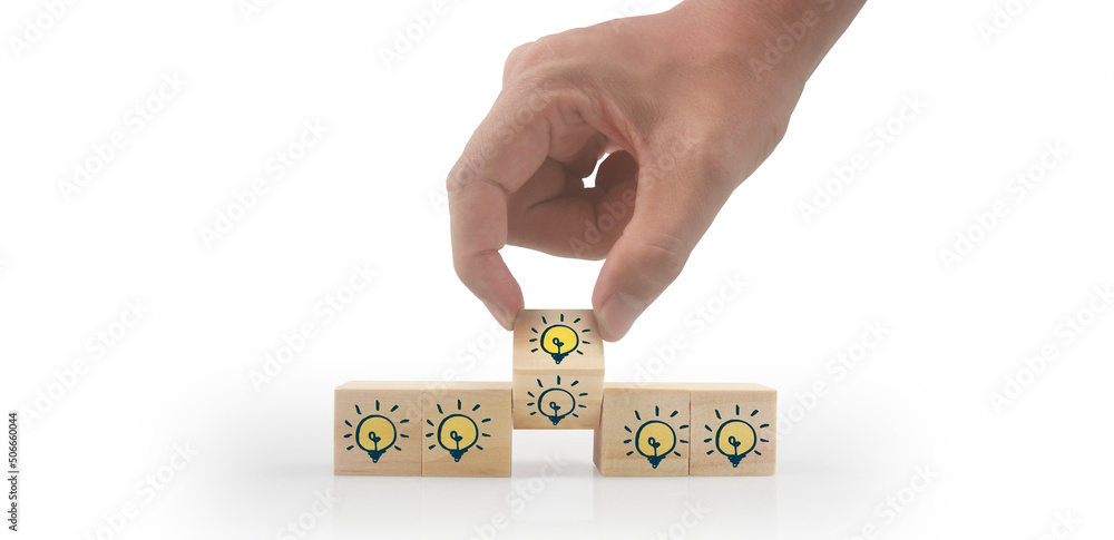 Fototapeta premium Wooden cubes in hand with copy space for input wording