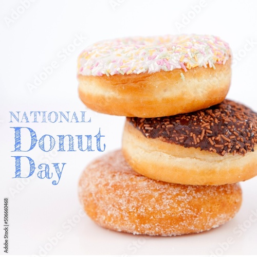 Composite of national donut day text with donuts stacked against white background, copy space