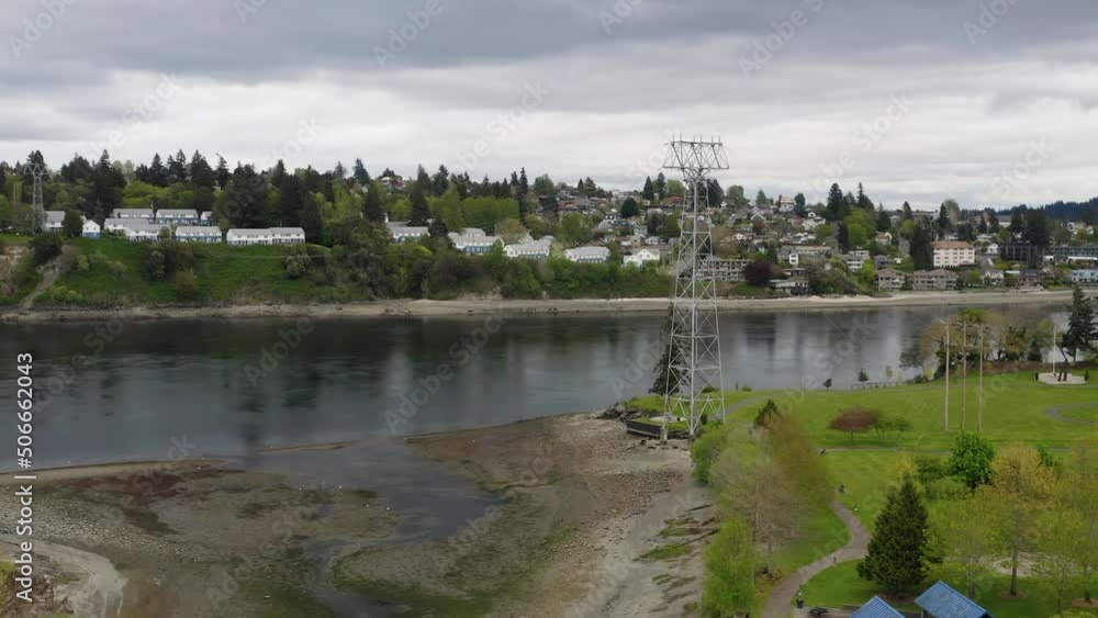 Coastal Evergreen Rotary Park In Kitsap County, Washington, United States With View Of Building Structures In The Background. Aerial Ascend