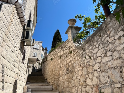 Old alley in Hvar Town, Croatia photo