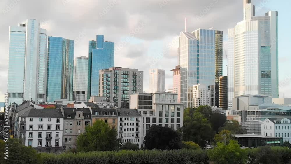 Frankfurt, Germany - September 10, 2019: Panoramic sunset view of city financial skyline from above the Main river Frankfurt, Germany - September 10, 2019: Panoramic sunset view of city financial skyline from above the Main river