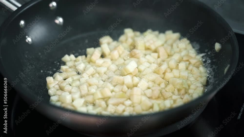 apple slices are fried in a frying pan apple slices are fried in a frying pan