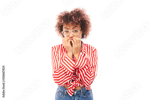 Funny curly girl holding her chin thinks doubts  makes decision isolated on white studio background