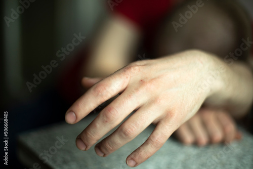 Hand of sleeping person. Guy fell asleep sitting down. © Олег Копьёв