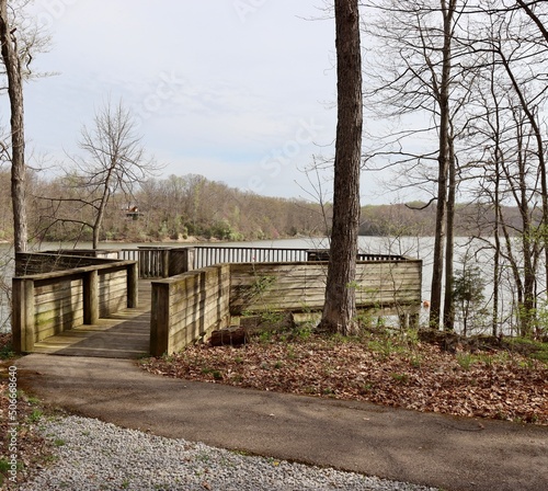 The wood overlook deck at the lake in the park.