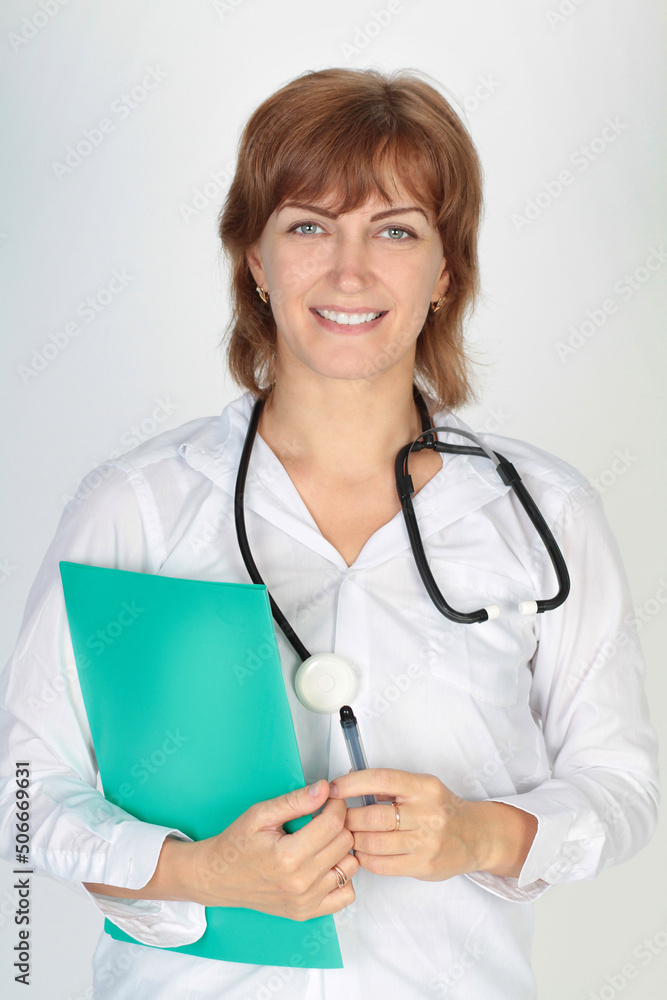 Portrait of a female doctor in a white uniform in the studio on a white background Portrait of a female doctor in a white uniform in the studio on a white background