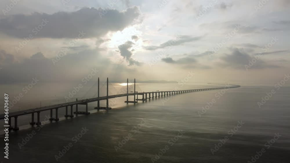 Aerial view sun ray at the Penang Second Bridge. Calm morning at seascape Aerial view sun ray at the Penang Second Bridge. Calm morning at seascape