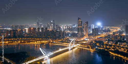Aerial night view of the city skyline of Nanjing Youth Olympic Center and Nanjing Eye Bridge in Nanjing, Jiangsu, China