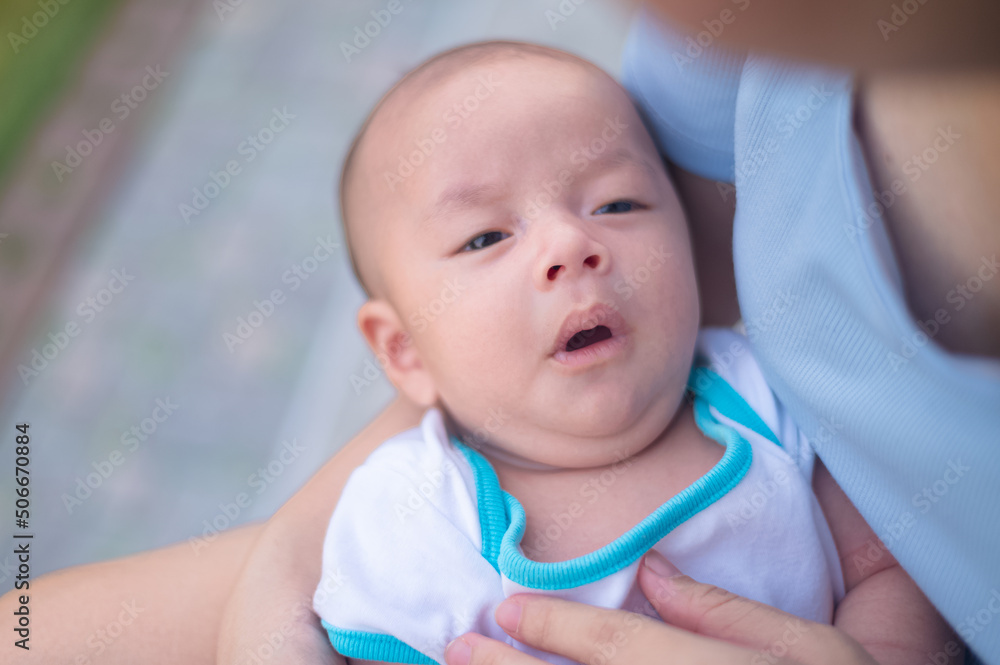 Infant baby with mom at home. Mother holding baby newborn love Infant baby with mom at home. Mother holding baby newborn love