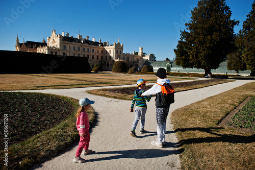 Three kids walking at Lednice park, Czech Republic. photo