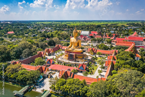 Aerial view of Wat Pikul Thong Phra Aram Luang or Wat Luang Por Pae temple with giant Buddha, in Sing Buri, Thailand photo