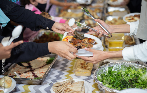 Canvas Print Selective focus shot of food being served on paper plate during hari raya party in Kuala Lumpur, Malaysia