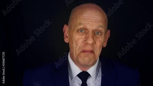 A clueless businessman looking dumbfounded