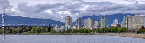 Residential Homes near Stanley Park and English Bay Beach in Downtown Vancouver  British Columbia  Canada. West Coast of Pacific Ocean and mountains in background.