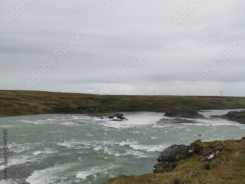 A stopp on the roadtrip in iceland with wild water river and rocks in the floss 