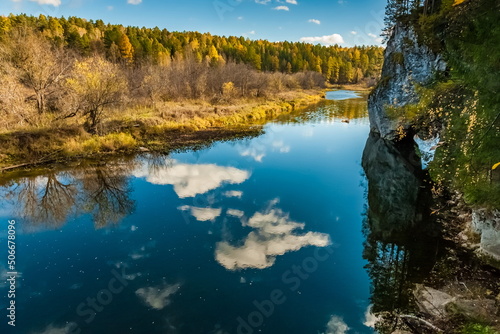 Fototapeta Naklejka Na Ścianę i Meble -  Autumn landscape with river, trees, grass and blue sky