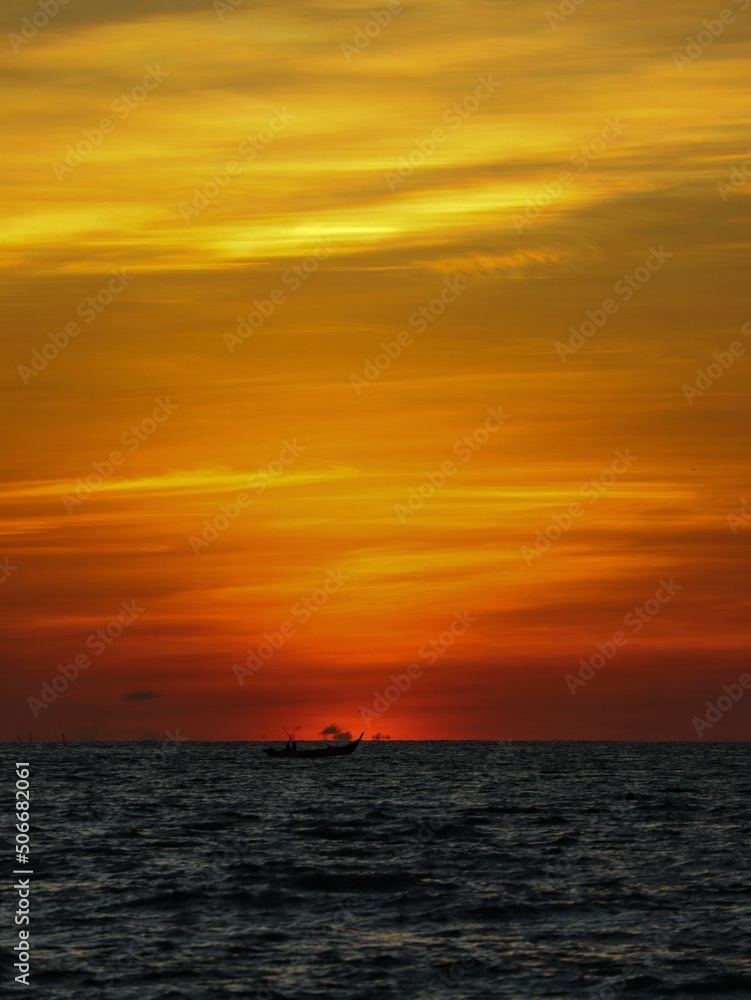 dark orange sky over the ocean after sunset