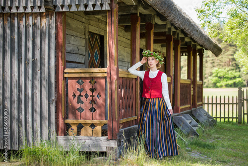 Latvian woman in traditional clothing. Ligo folk.