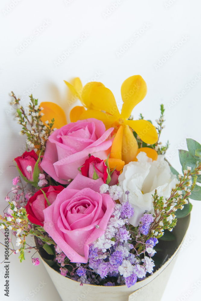 Beautiful and romantic bouquet on white background (rose, orchid, bellflower, gypsophila)