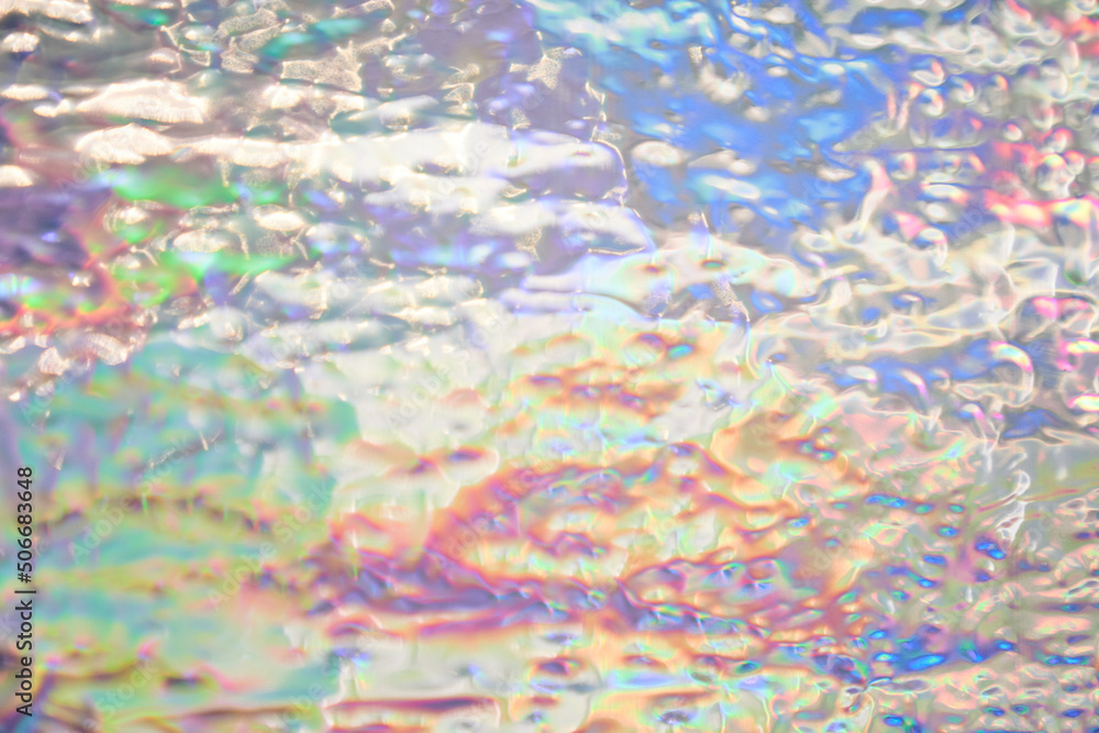 Holographic iridescent background wrinkled wavy abstract rainbow blurred background. Surface with multiple colors of webpunk in 90's style. High quality photo
