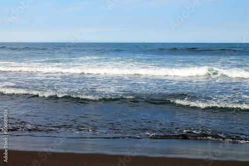 Kamchatka, Khalaktyrsky beach with black volcanic sand in the Pacific Ocean. High quality photo