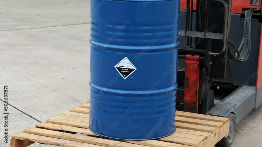 Corrosive chemical symbols on a blue chemical tank Corrosive chemical symbols on a blue chemical tank