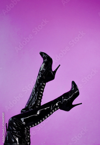 Quadro em tela man with women's boots with black heels on a pink background, lgbtq concept, tra