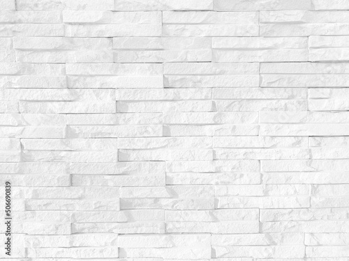 Seamless texture of white grey brick stone wall a rough surface, with space for text, for a background.
