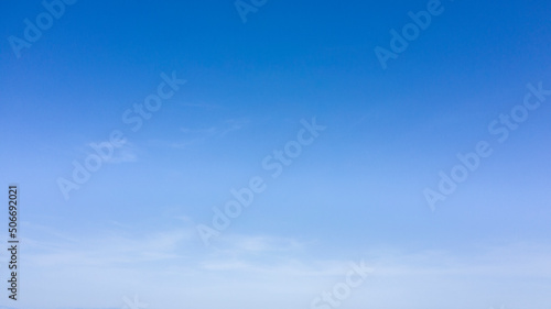 Shades of blue in the sky with some clouds.