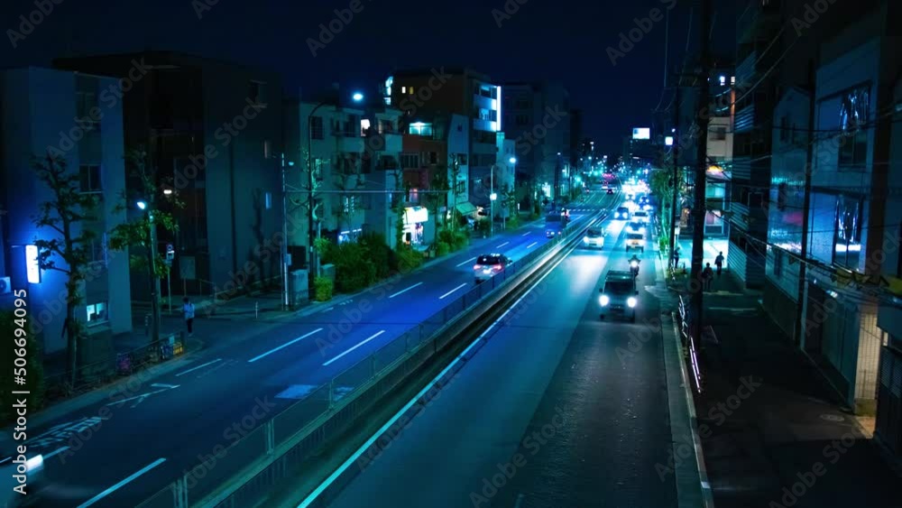 A night timelapse of the traffic jam at the downtown street in Tokyo wide shot zoom A night timelapse of the traffic jam at the downtown street in Tokyo wide shot zoom
