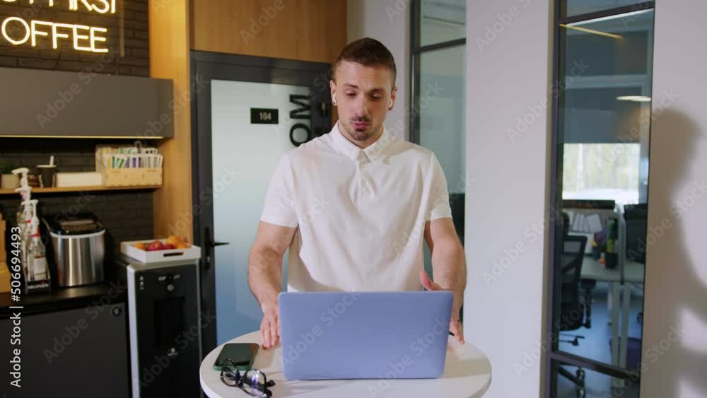 A man makes a video call in the office A man makes a video call in the office
