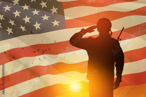 USA army soldier saluting on a background of sunset or sunrise and USA flag. Greeting card for Veterans Day, Memorial Day, Independence Day. America celebration. 3D-rendering.