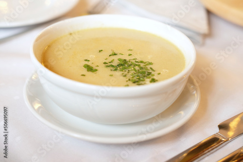 cream wild mushroom soup in white bowl -selective focus