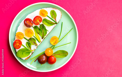 Fototapeta Naklejka Na Ścianę i Meble -  bread with tomatoes on plate, fresh breakfast or dinner plate isolated on red background