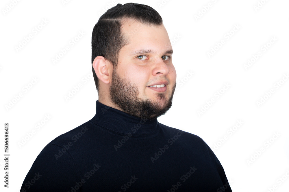 Fototapeta premium Young man headshot. He stands towards his left side and turns back his head to look at the camera with a smile