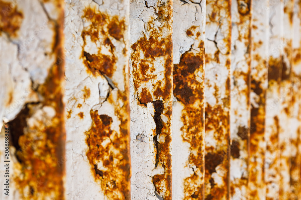 Fototapeta premium Rusty bridge railing texture background with cracked white paint