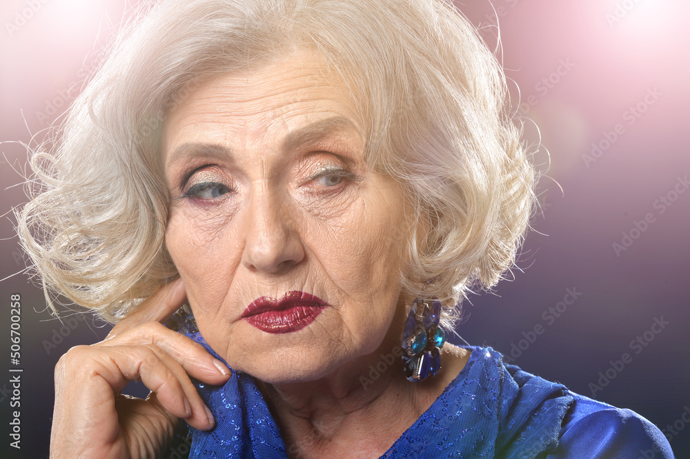 Portrait of a beautiful elderly woman with makeup